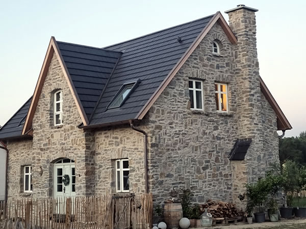 Bewertung Hausbau englisches Cottage mit Natursteinfassade bei Wittingen - Bauunternehmen Alan Berry aus Celle, ihr Maurer für englische Cottages und Landhäuser in Celle. Nachhaltiger Hausbau mit historischen Baustoffen. Bewertung Hausbau englisches Cottage mit Natursteinfassade bei Wittingen - Englische Cottages aus Celle - Bauunternehmen Alan Berry